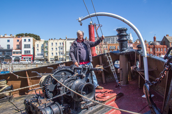 Michael on the steam tug Cervia in the Royal Harbour at Ramsgate, Thanet, Kent , UK